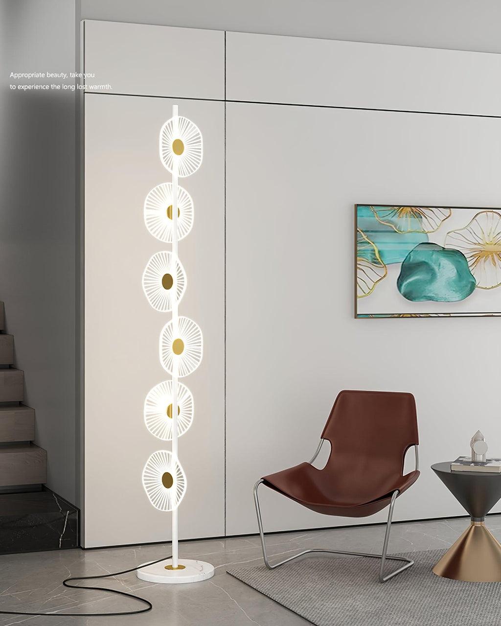 Near a leather accent chair and a wall printed with text, this Clérachic floor lamp's lit discs stand out against the pale wall.