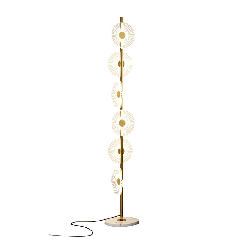 Cropped closer in studio, this Clérachic floor lamp shows its tiered acrylic discs and looping cord against plain white.