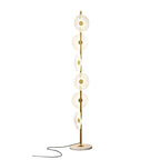 Cropped closer in studio, this Clérachic floor lamp shows its tiered acrylic discs and looping cord against plain white.