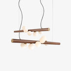 Opal glass globes set at varied heights along a walnut bar