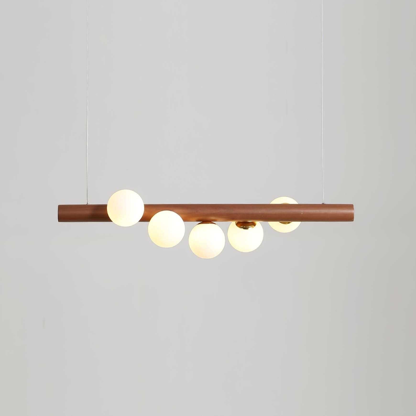 Linear wood pendant light with walnut bar and opal glass globes