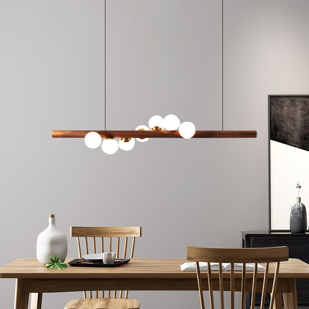 Walnut pendant light detail showing glass globe and grain