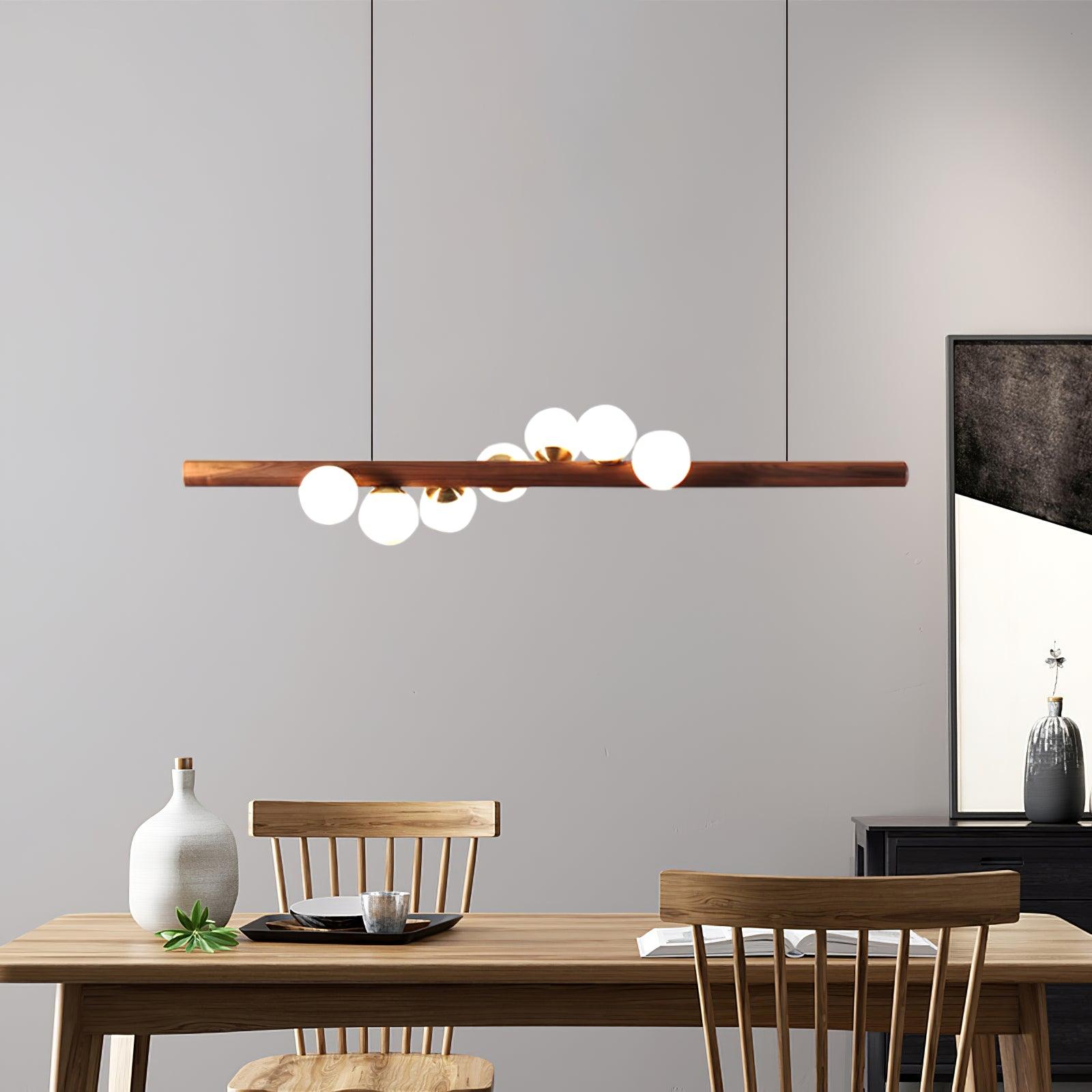 Walnut pendant light detail showing glass globe and grain
