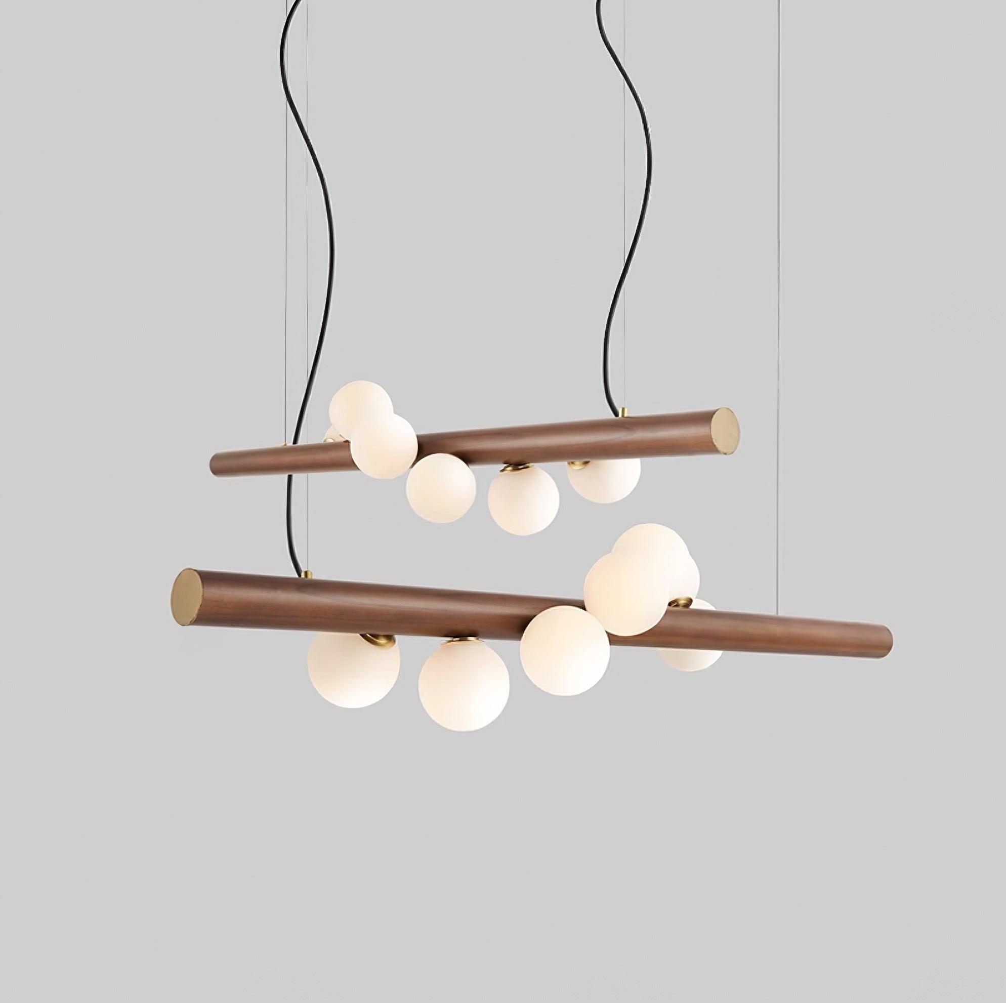 Side view of walnut pendant light with row of glass globes