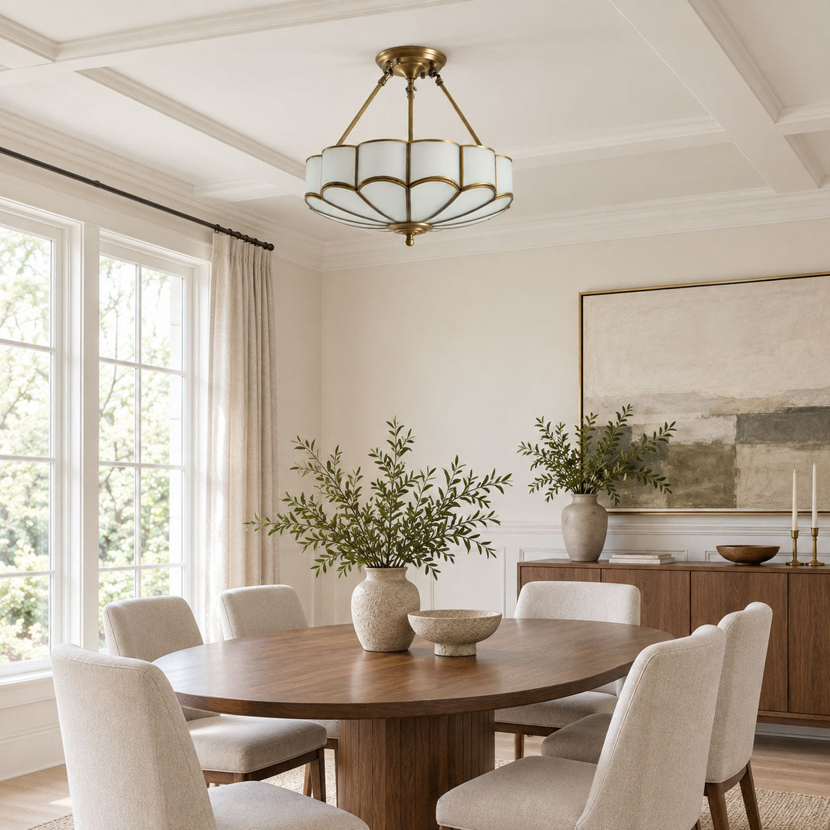 Under a coffered ceiling in a dining room with tall windows, this Clérachic ceiling light glows above a wood table.