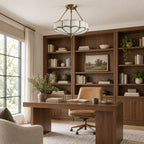 In a home office with dark wood shelving and a leather chair, this Clérachic ceiling light glows near the window.