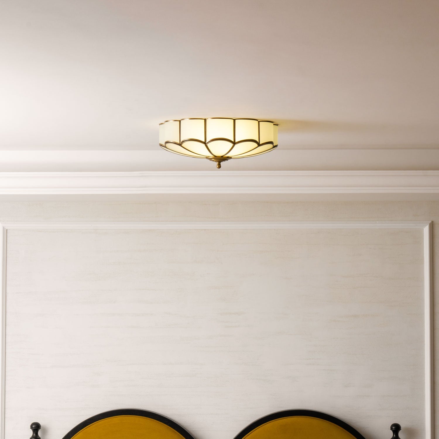 Flower-shaped glass ceiling light with warm ambient glow