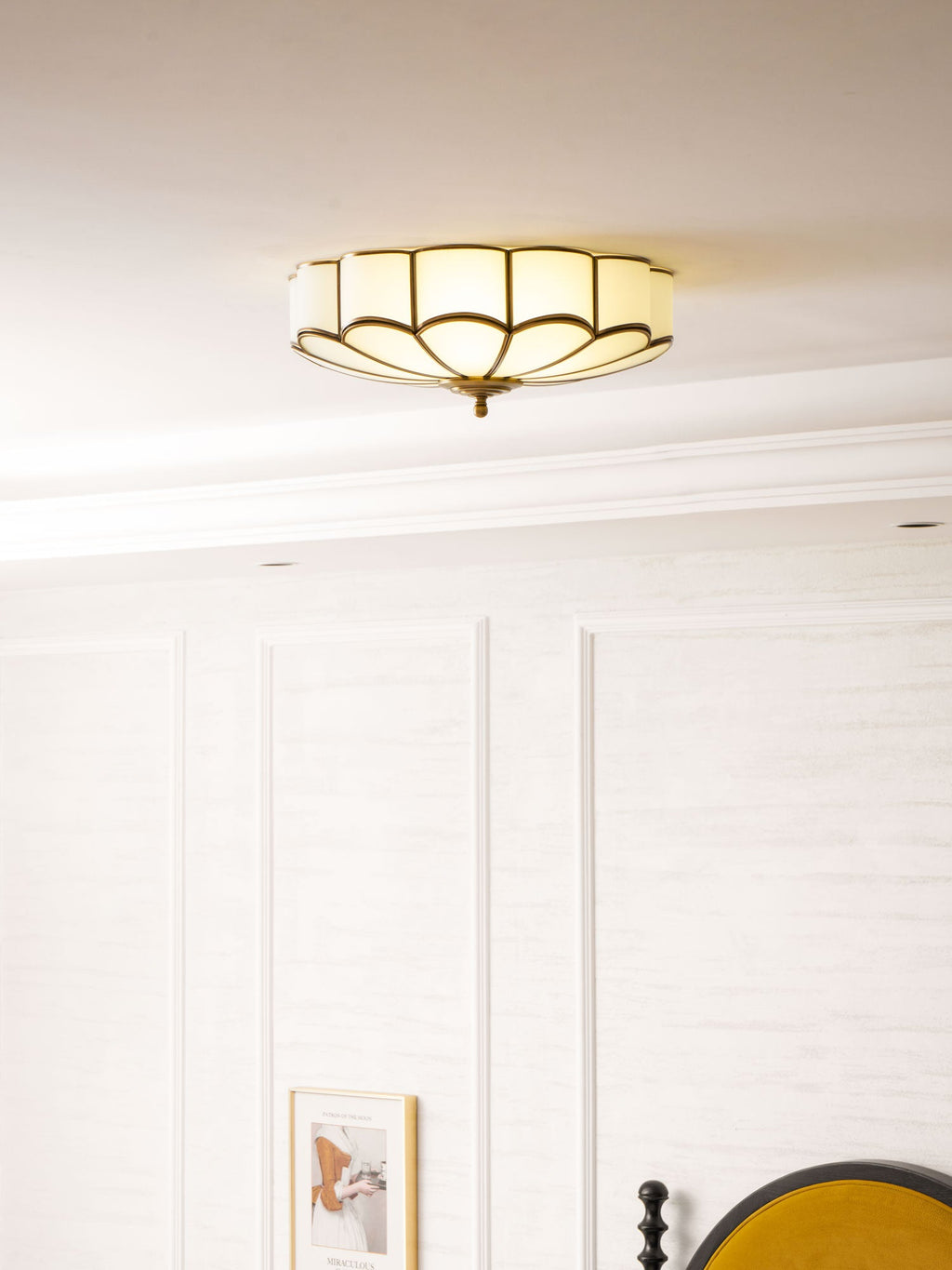 Brass-framed flower ceiling light with warm diffused light