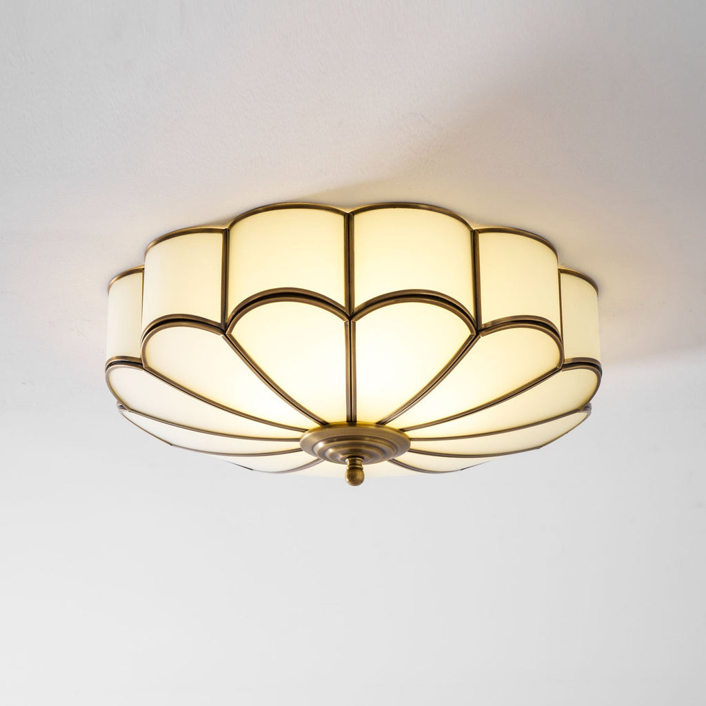 Frosted glass petal ceiling light casting a soft glow