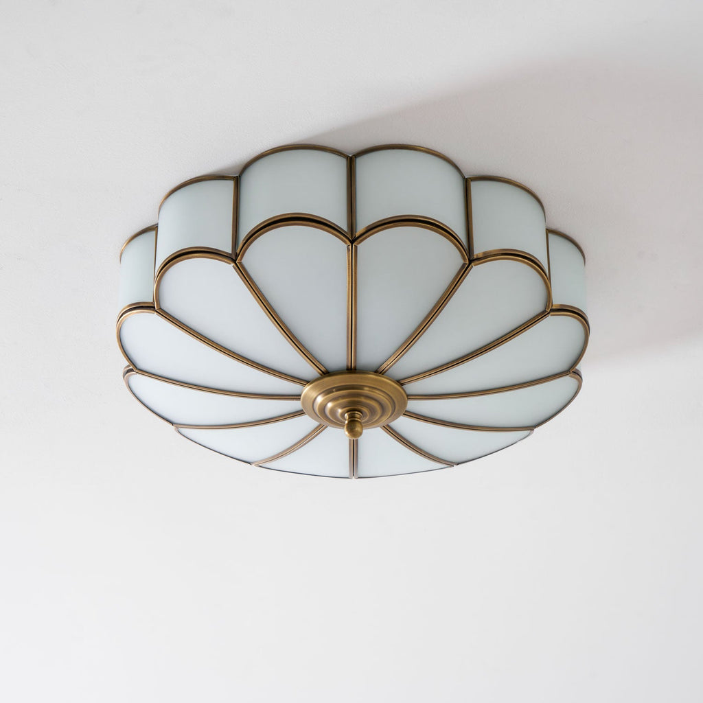 Brass flower ceiling light with frosted glass shades detail