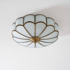 Brass flower ceiling light with frosted glass shades detail