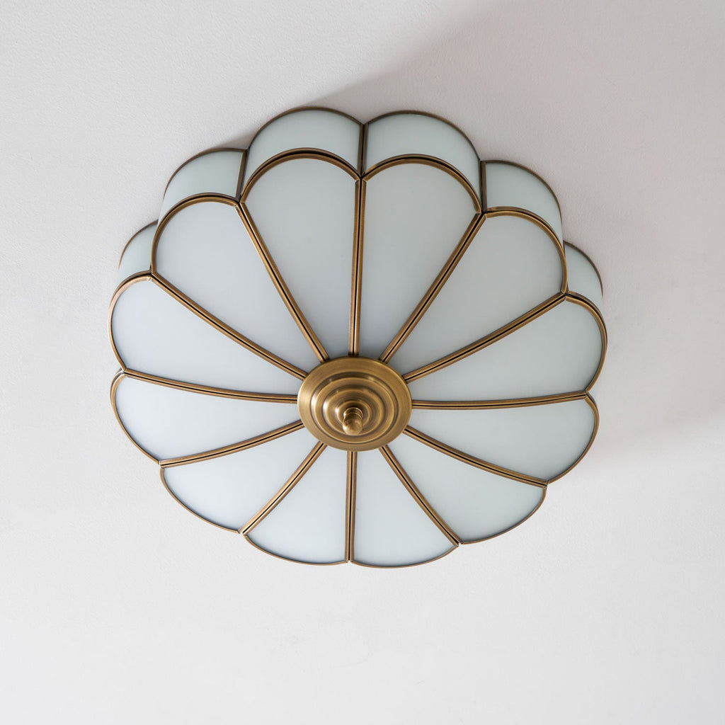 Frosted glass petal ceiling light detail with brass frame