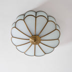 Frosted glass petal ceiling light detail with brass frame
