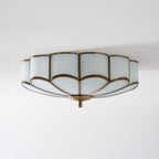 Flower-shaped brass ceiling light with soft frosted glow