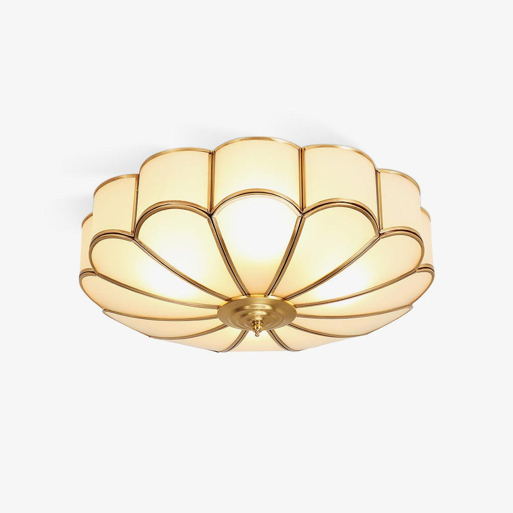 Flower-shaped ceiling light with frosted glass shades and brass frame