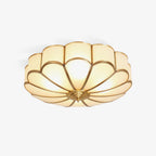Flower-shaped ceiling light with frosted glass shades and brass frame