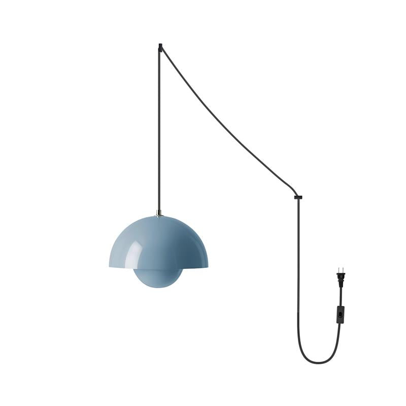 Dusty blue flowerpot-style pendant lamp hung from a black swag cord that runs to a plug and switch