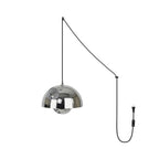 Mirror-chrome pendant lamp, the polished sphere diffuser catching reflections beneath the dome