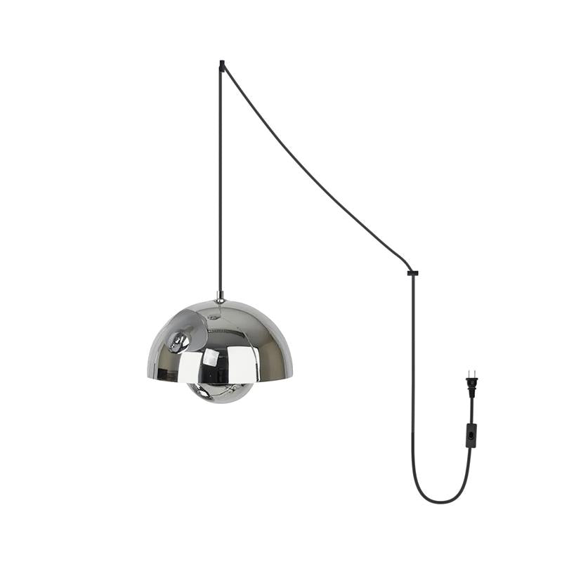 Mirror-chrome pendant lamp, the polished sphere diffuser catching reflections beneath the dome