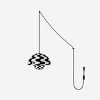 Monochrome wave-print pendant lit on a pale grey backdrop, cord swagged to a plug and switch