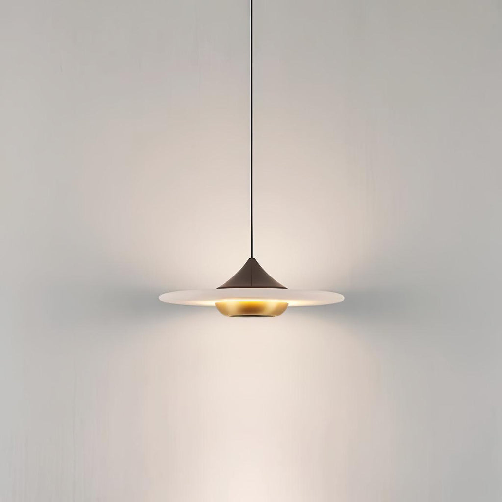 Clérachic white marble disc pendant light on a black cord and dome fitting, photographed on a plain grey background.