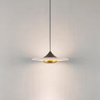 Clérachic white marble disc pendant light on a black cord and dome fitting, photographed on a plain grey background.