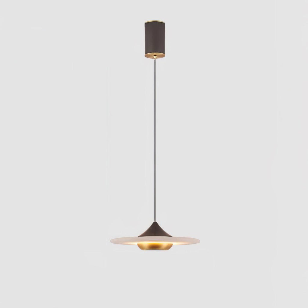 Clérachic white marble disc pendant light shown in full, from ceiling mount to glowing shade, on a plain grey backdrop.