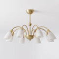 Photographed from the side on a plain backdrop, this Clérachic chandelier's brass frame supports eight cone-shaped alabaster shades.