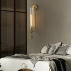 Brass wall sconce with ribbed glass shade detail view