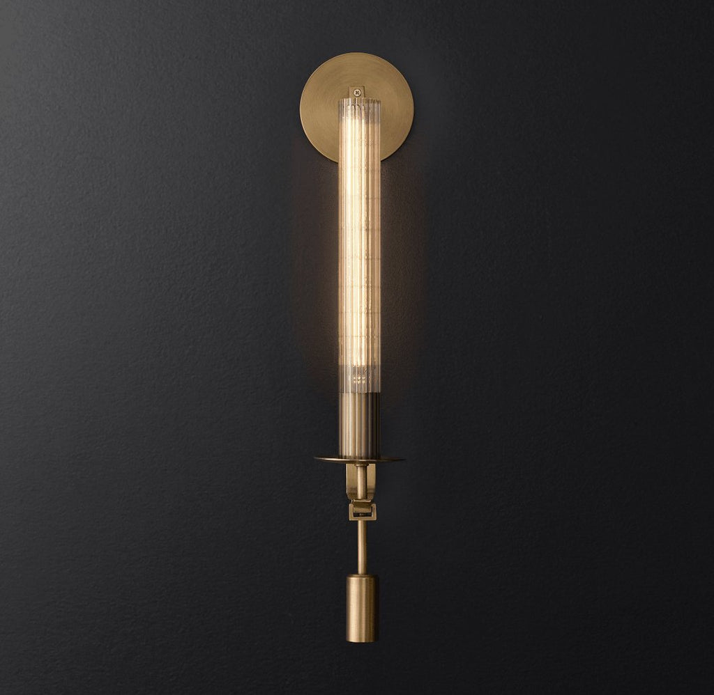 Brass wall sconce with ribbed glass shade and aged finish
