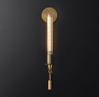 Brass wall sconce with ribbed glass shade and aged finish