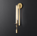 Brass wall lamp with cylindrical ribbed glass shade lit