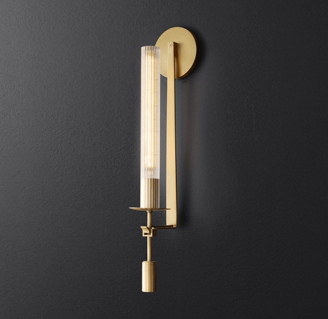 Brass wall lamp with cylindrical ribbed glass shade lit
