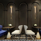 Brass sconces with ribbed glass shades in a styled interior