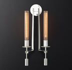 Brass wall sconce detail showing ribbed glass cylinder