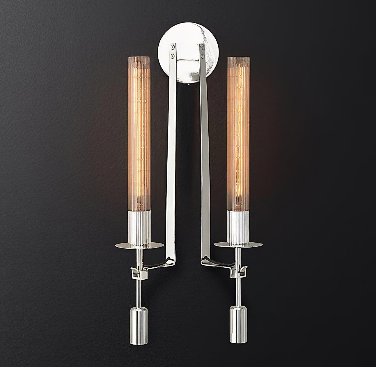 Brass wall sconce detail showing ribbed glass cylinder