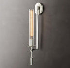 Brass wall sconce with cylindrical ribbed glass shade on wall