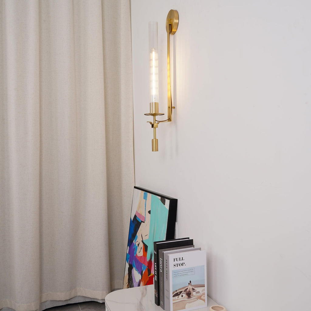 Brass wall lamp with ribbed glass shade close up detail