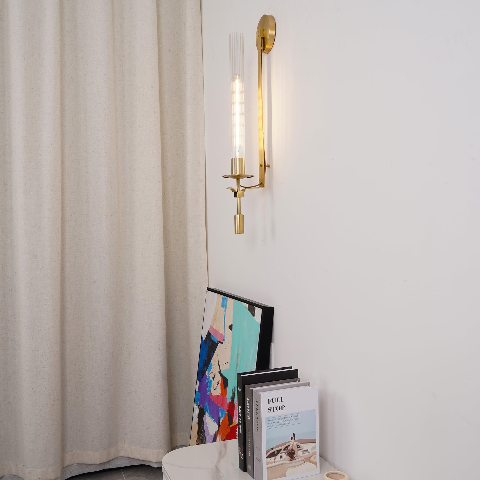 Brass wall lamp with ribbed glass shade close up detail