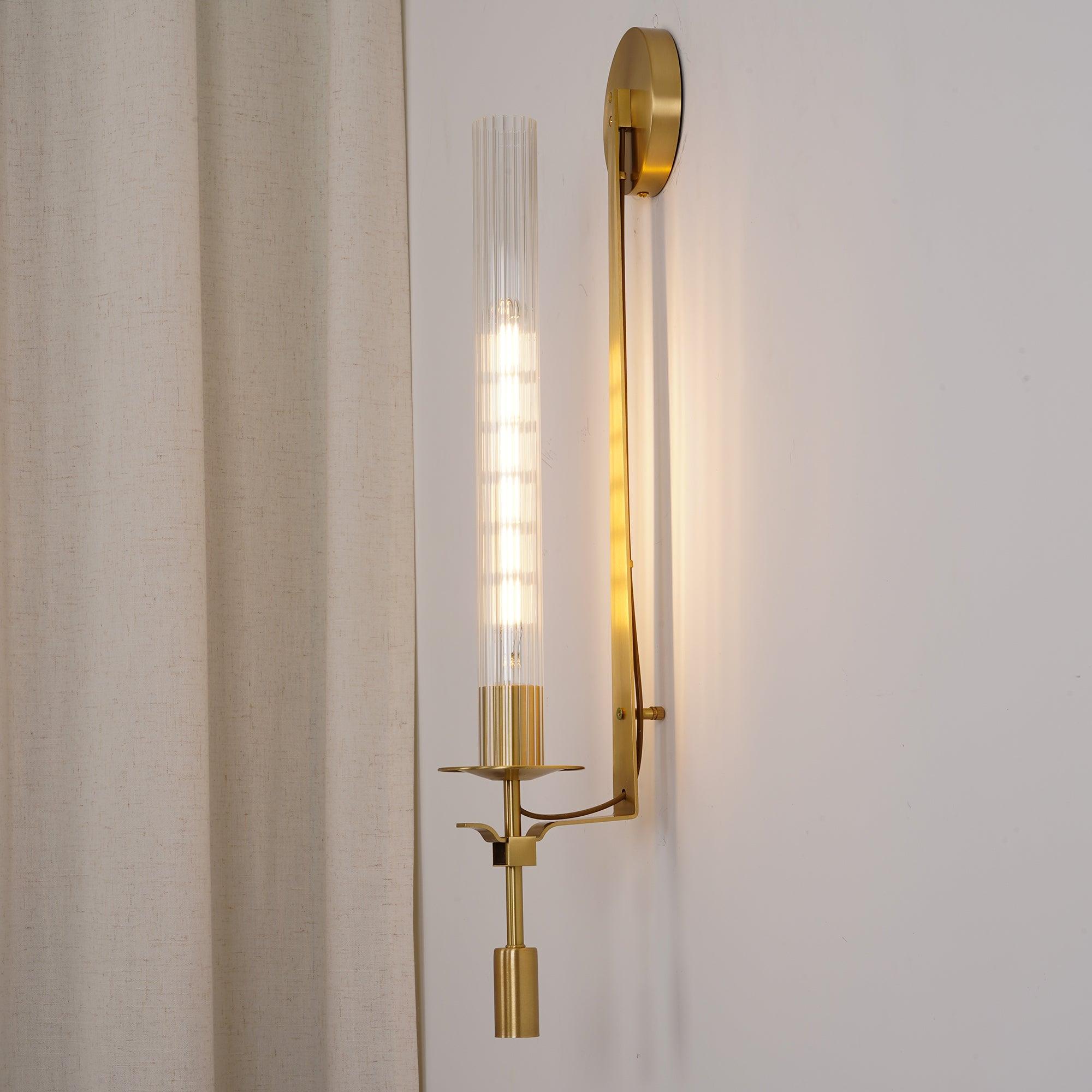 Brass wall lamp close up showing ribbed glass texture