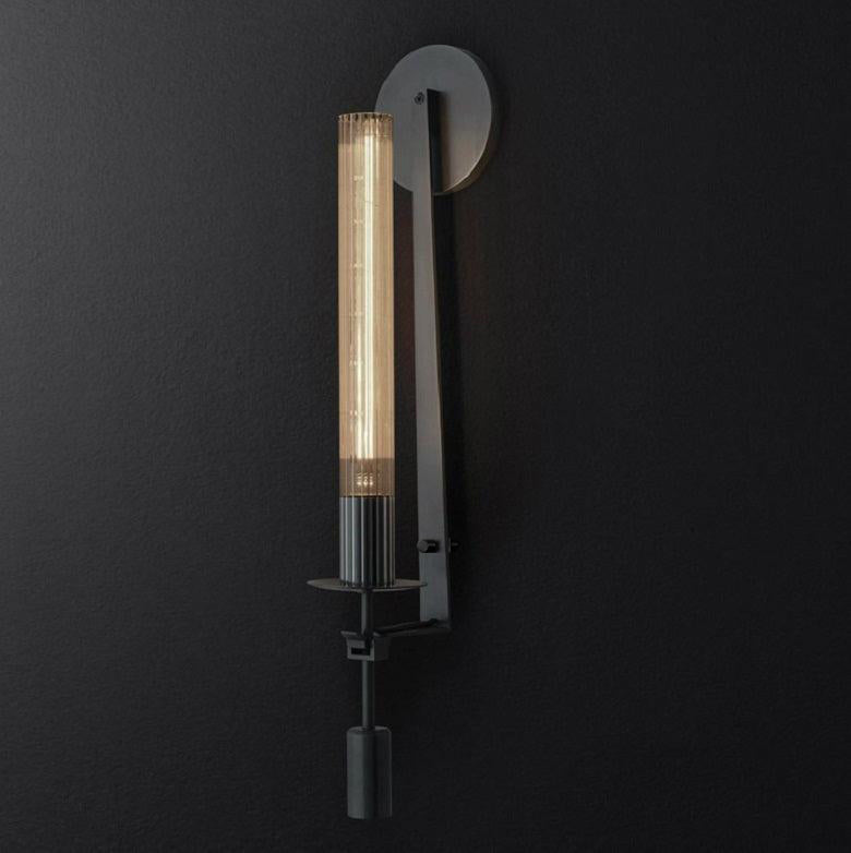 Solid brass wall lamp with ribbed clear glass shade