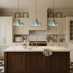 Pleated glass pendant light with brass body on a plain backdrop