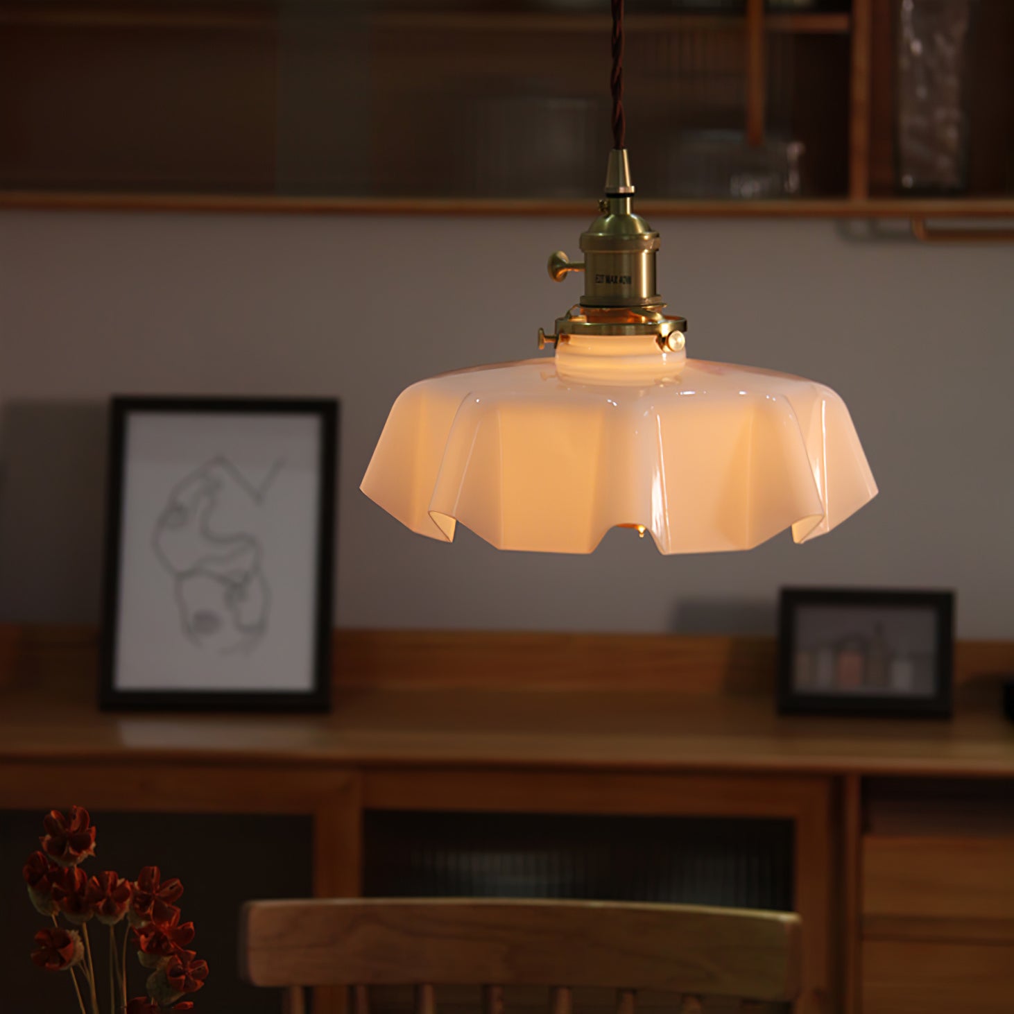 Pleated glass pendant light with brass fitting in an interior