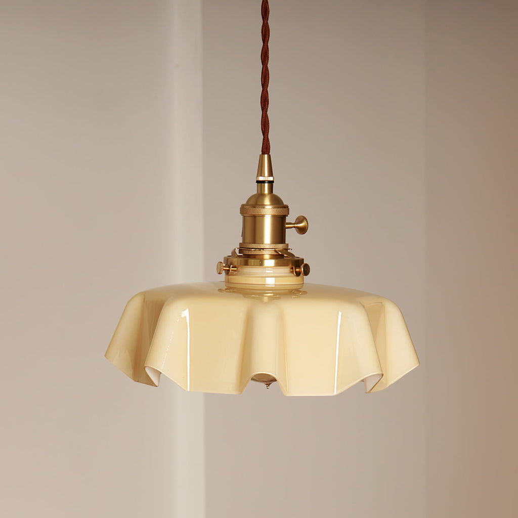 Pleated glass pendant light casting soft dappled light