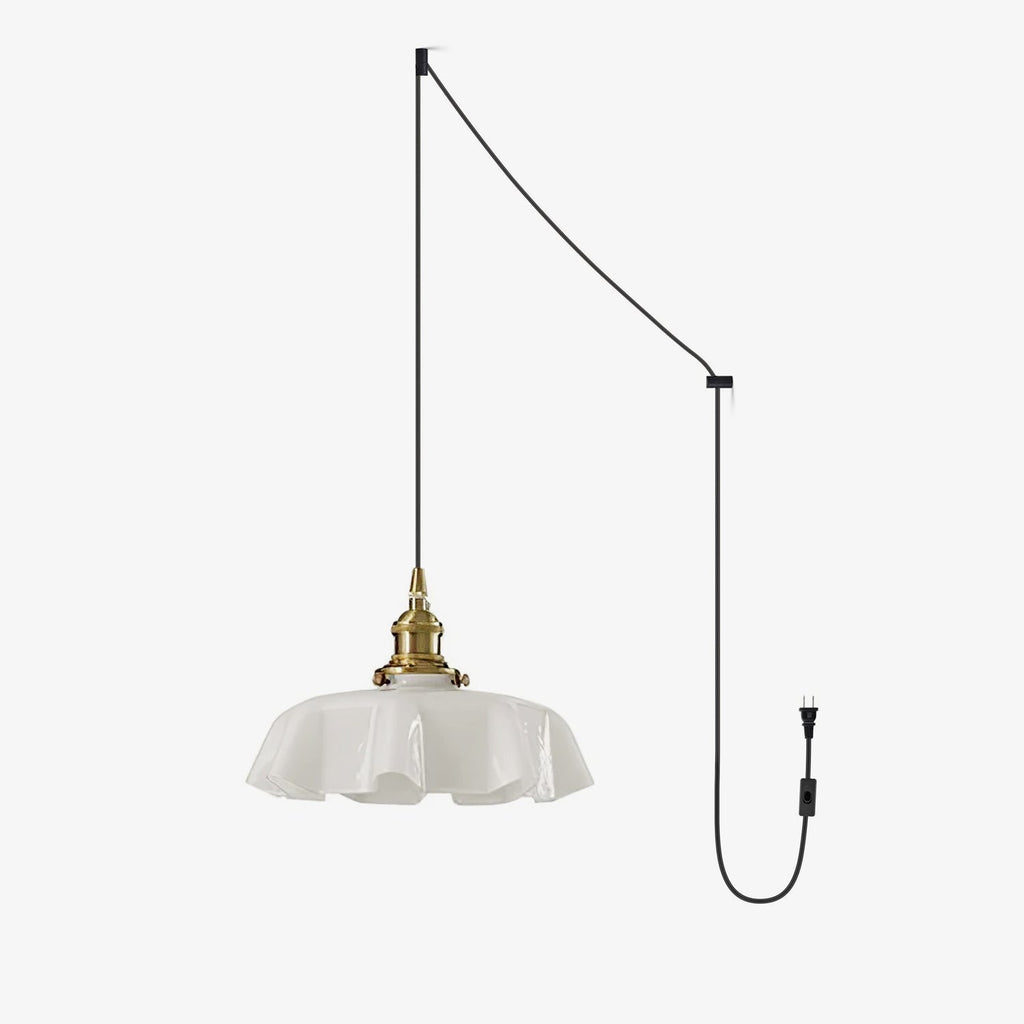 This Clérachic pendant's plug-in diagram routes a black cord from ceiling hook to wall plug, ending in the white pleated shade.