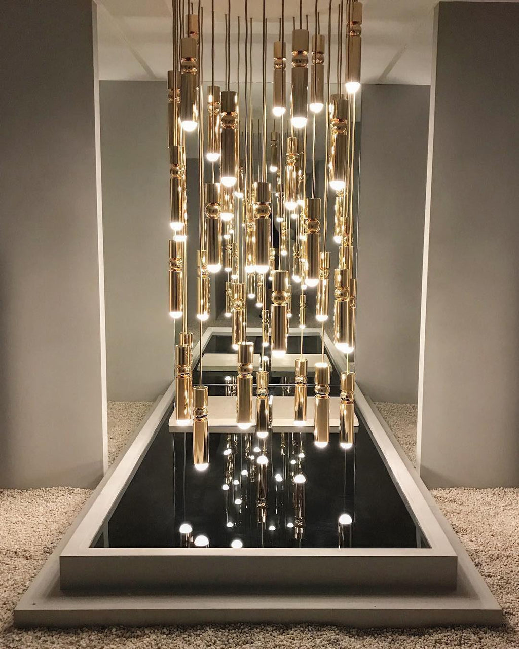 Geometric pendant light cluster casting an architectural glow