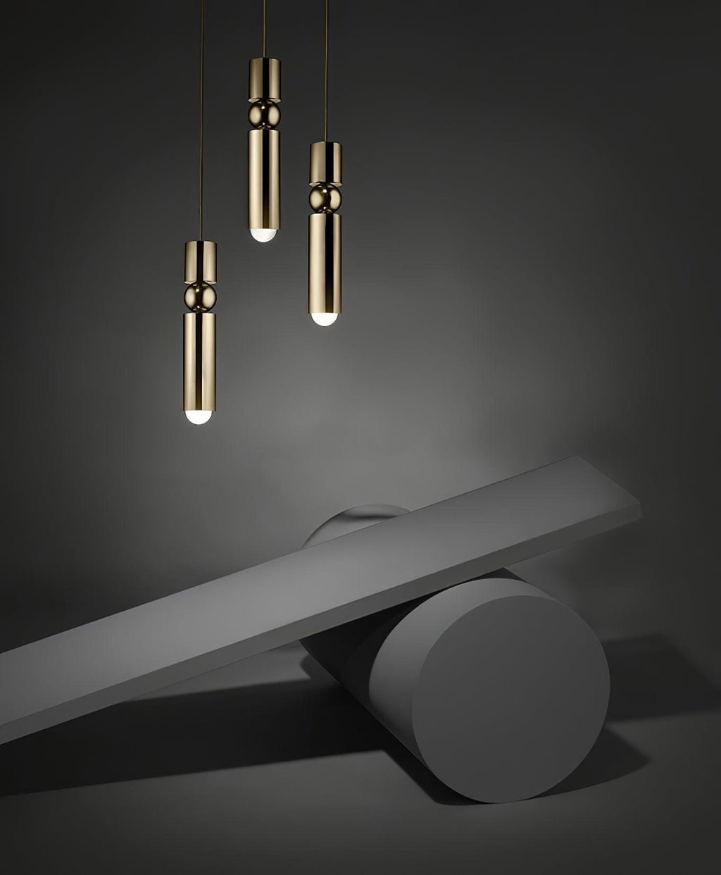 Cylinder cluster pendant light suspended over a dining setting