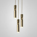 Cylinder cluster pendant light casting warm light from above