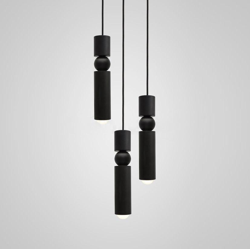Multi-head pendant light cluster glowing in an open space