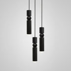 Multi-head pendant light cluster glowing in an open space